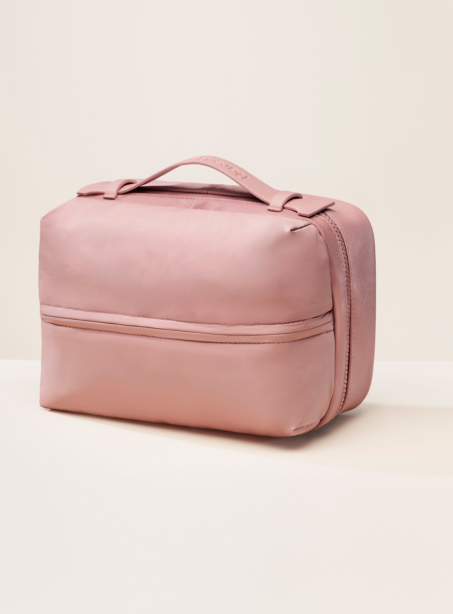pdp-puffy-toiletry-bag-mauve-handle-1